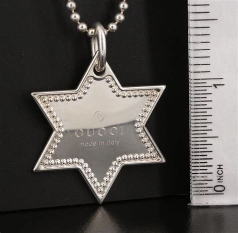 gucci star necklace.